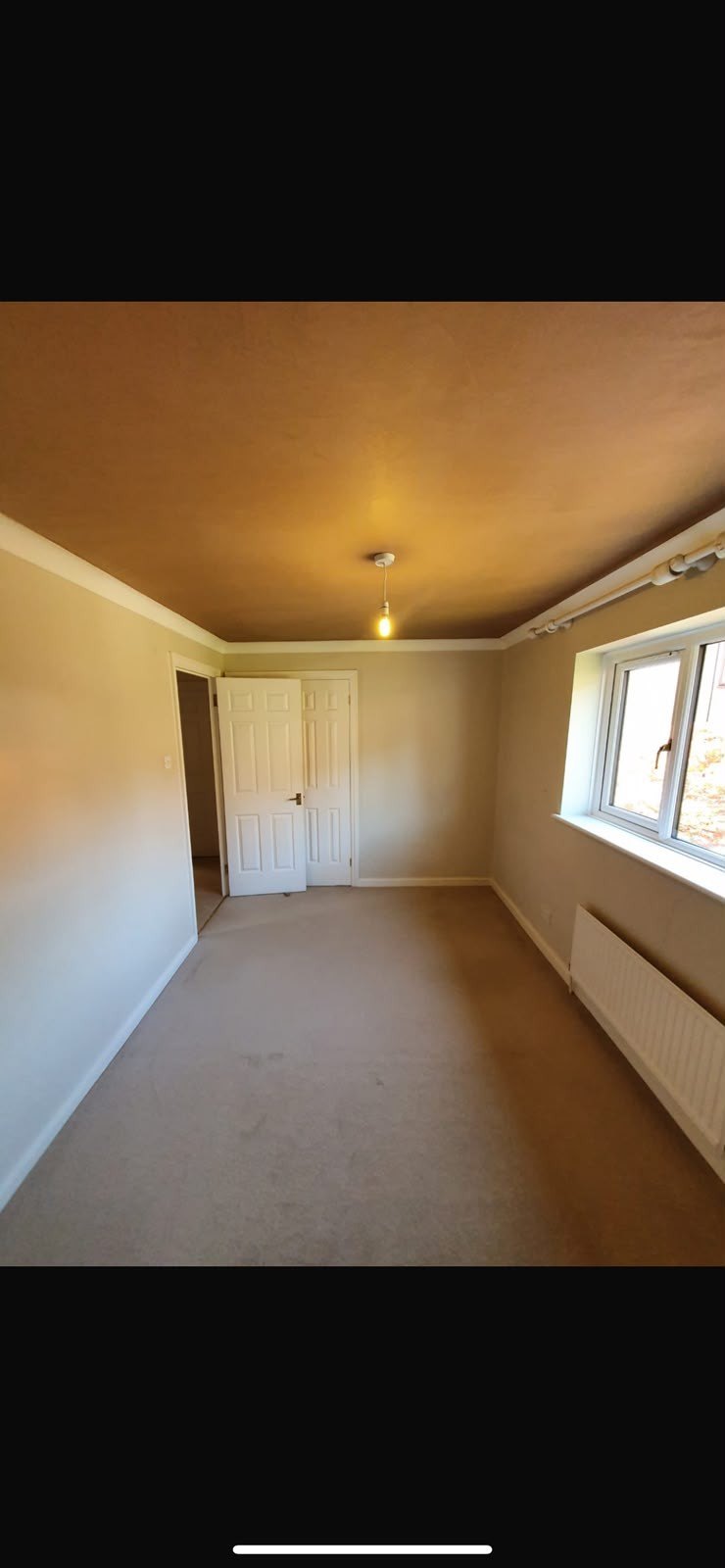 Room skimmed by radiator and window, after