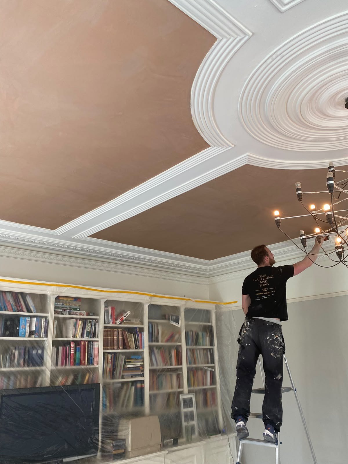 Working at the ceiling rose from the steps, during