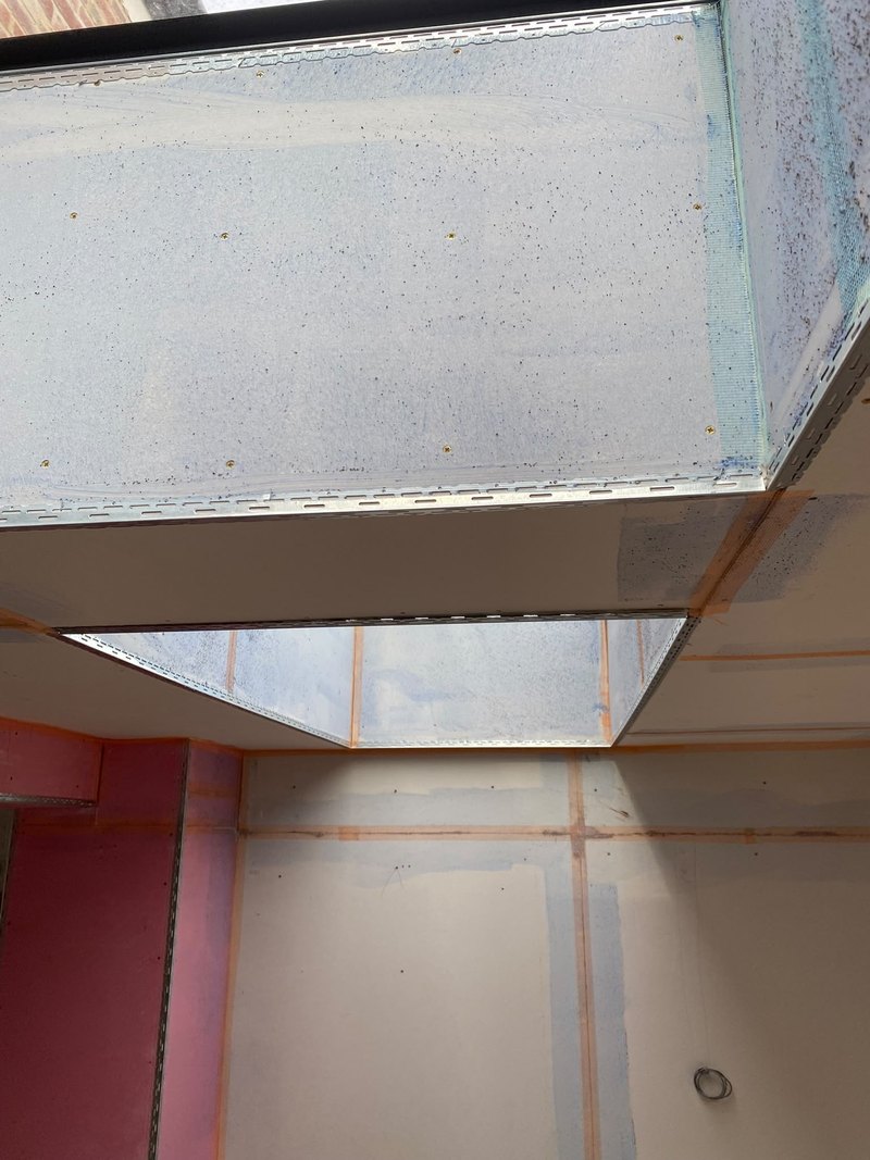 Ceiling boarded around the rooflight, during