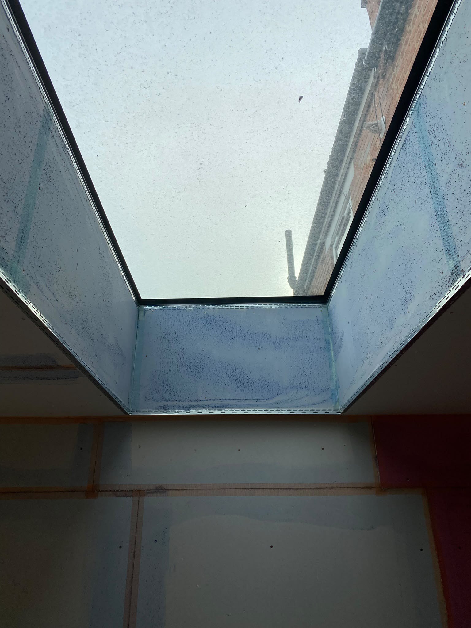 Rooflight reveal boarded and taped, during
