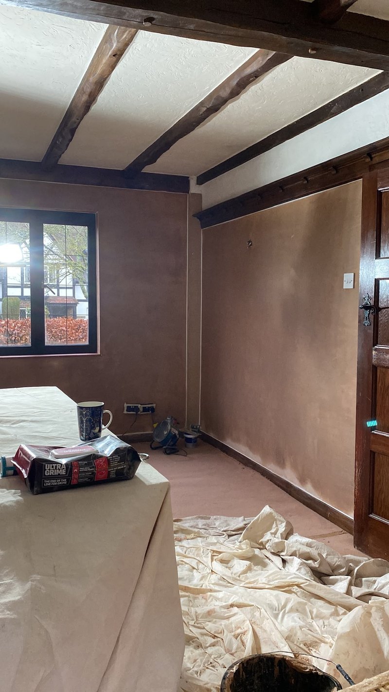 Beamed room skimmed under dust sheets, during