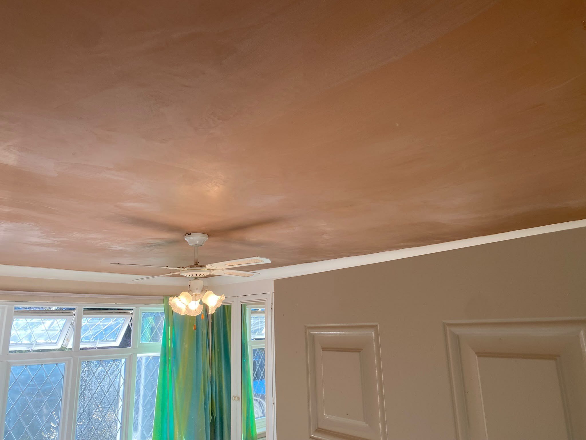 Ceiling skimmed around the fan, after