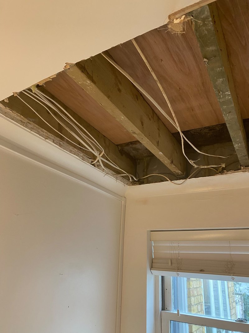 Ceiling opened to joists and old lath, before