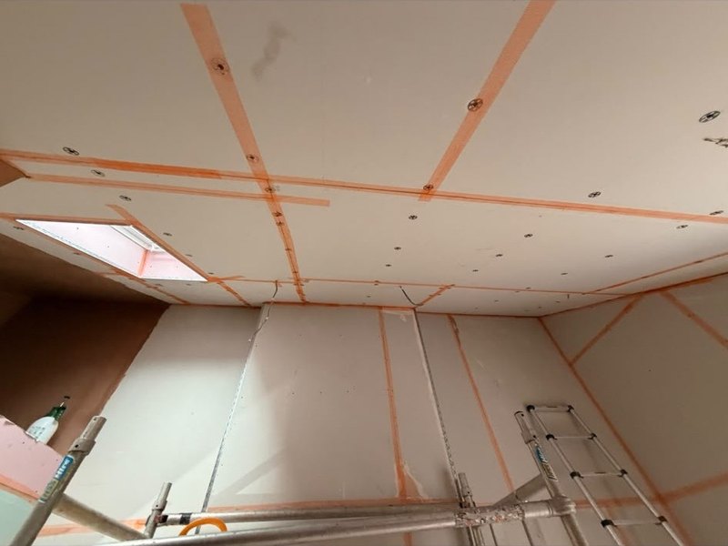 Extension ceiling boarded and taped, before