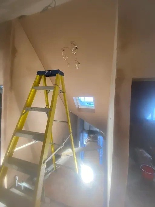 Loft room ceiling and wall skimmed, after