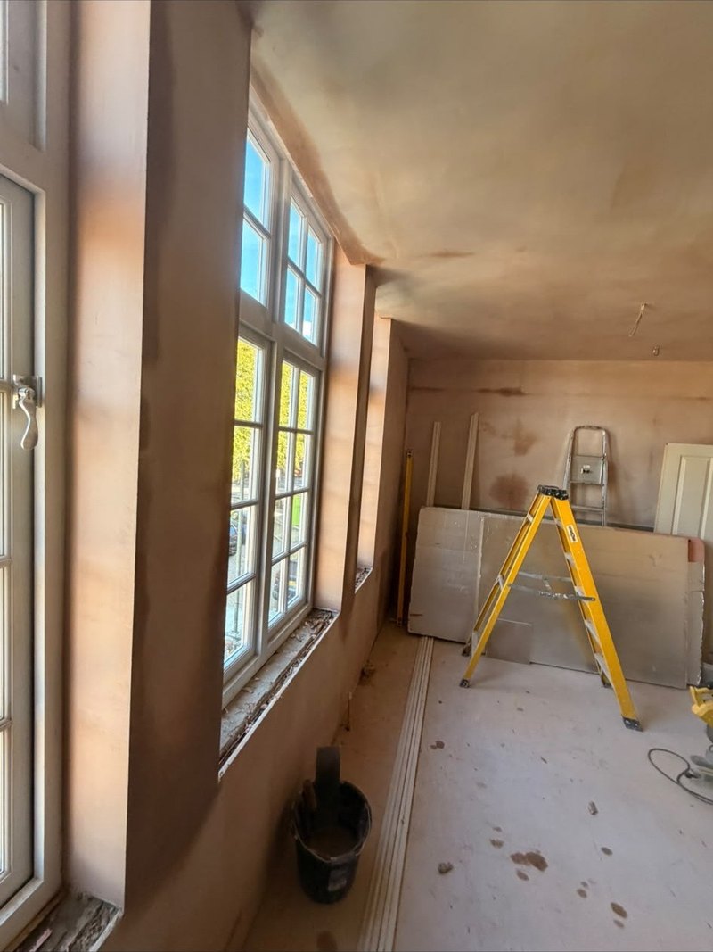 Garden room walls skimmed to the windows, after