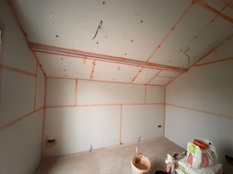 Loft room boarded and taped, during