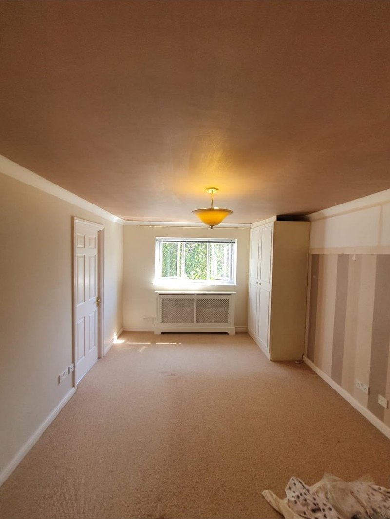 Bedroom ceiling skimmed to the cornice, after