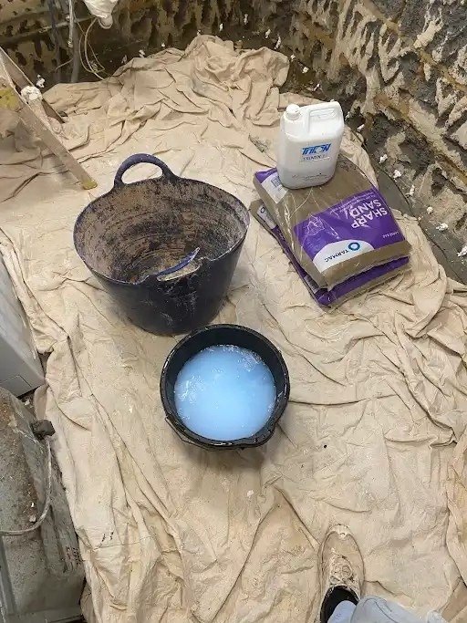 Sharp sand and sbr set out for render, during