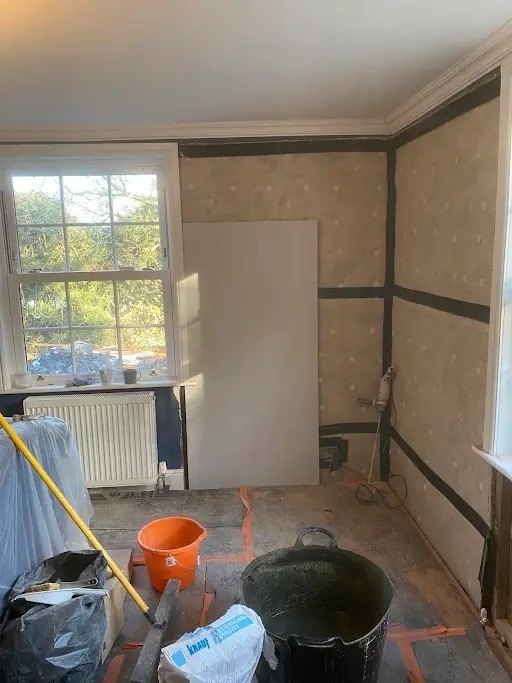 Period room sheeted and prepped, during