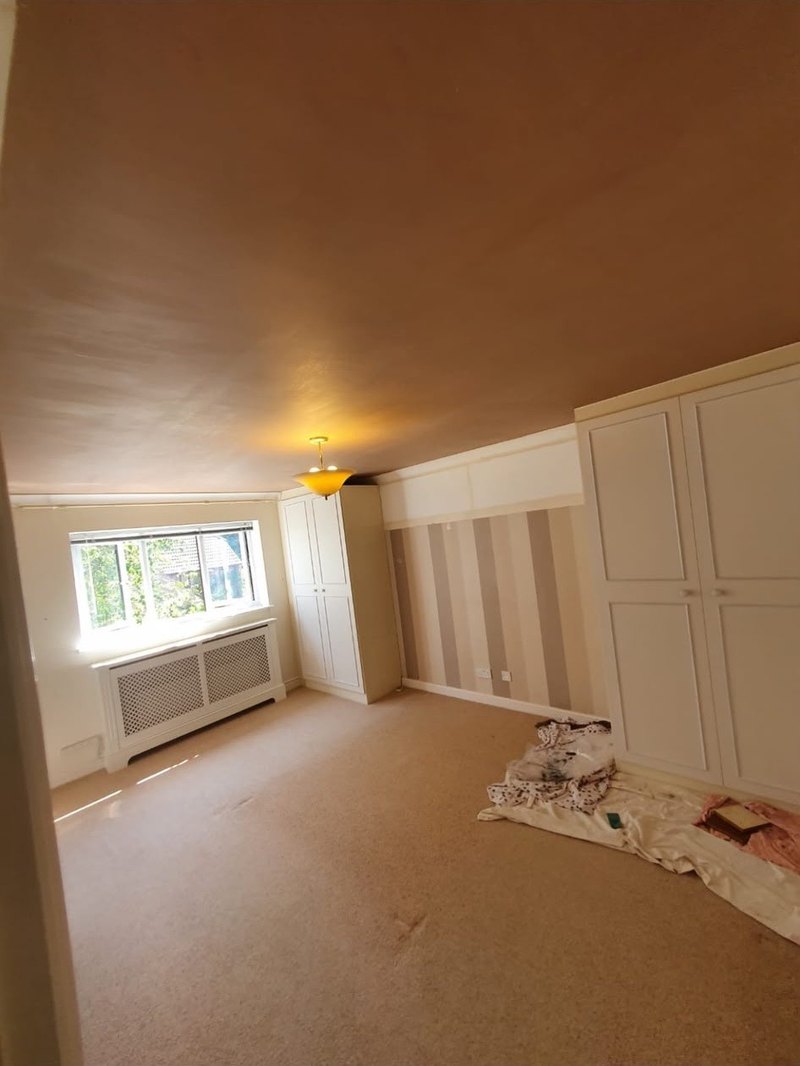 Bedroom ceiling skimmed around fitted wardrobes, after