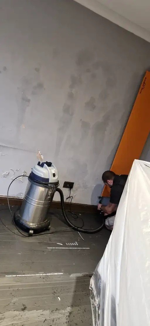 Dust extraction running on a sheeted floor, during
