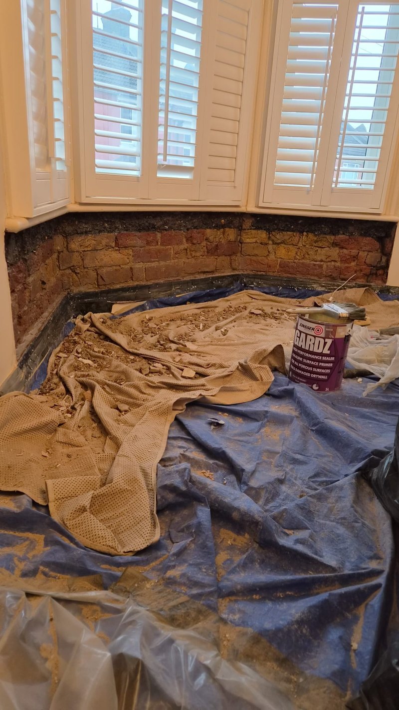 Bay window room stripped, before