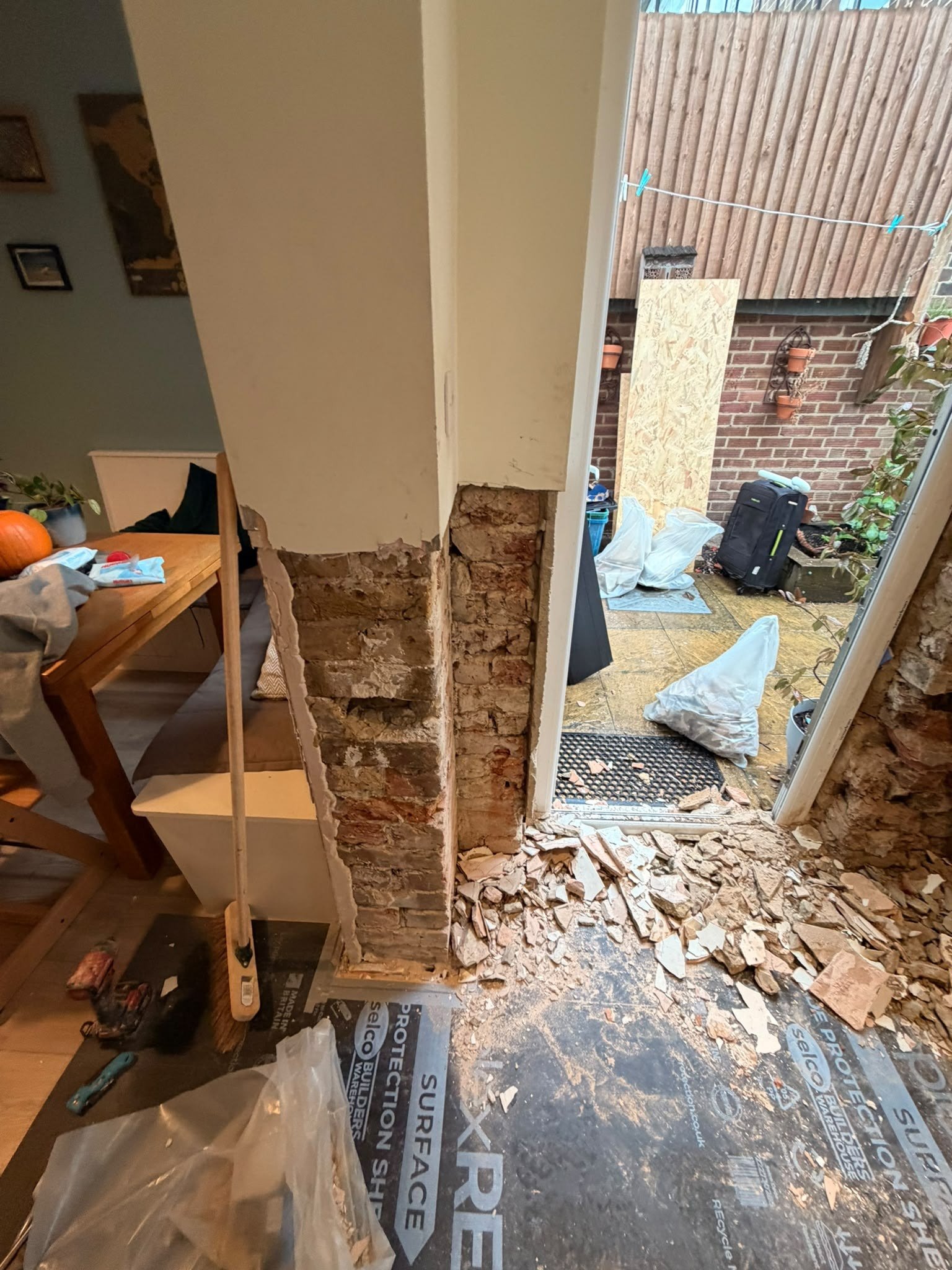 Damp door corner stripped, before