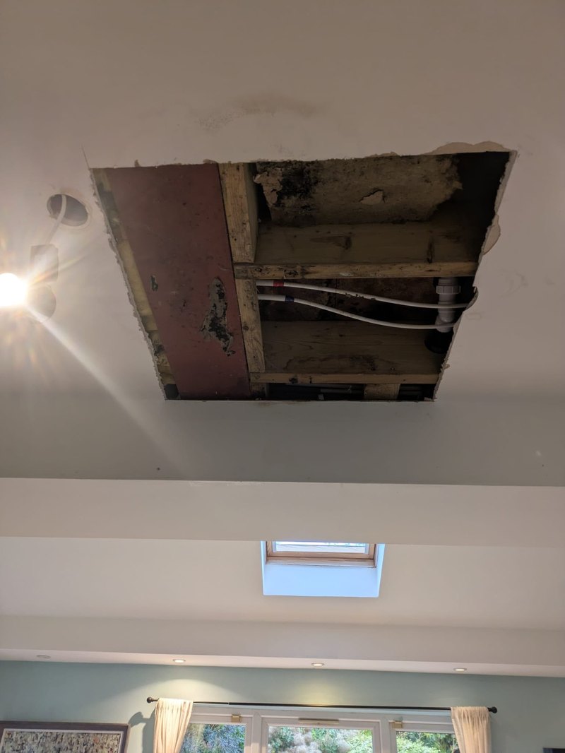 Kitchen ceiling leak hole cut out, before