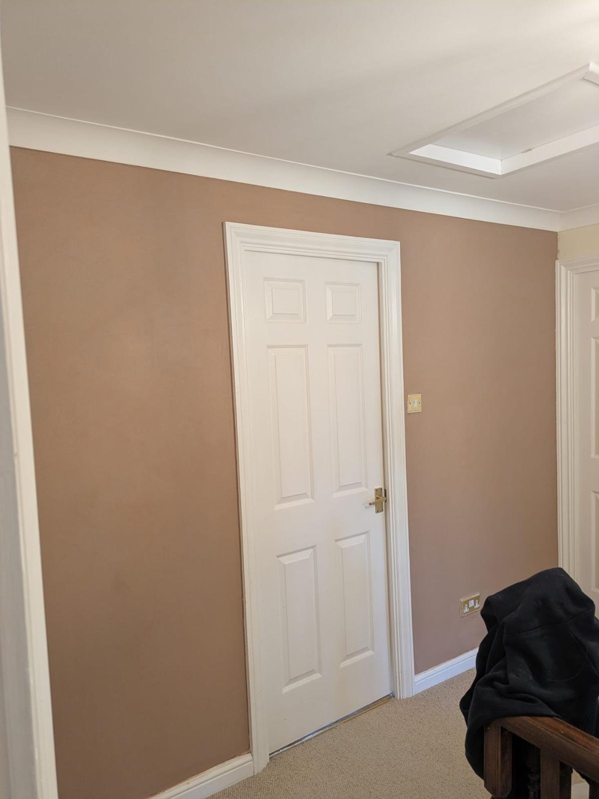 Landing wall skimmed and painted wide, after