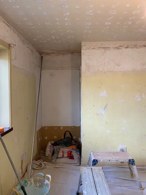 Bedroom stripped artex ceiling, before