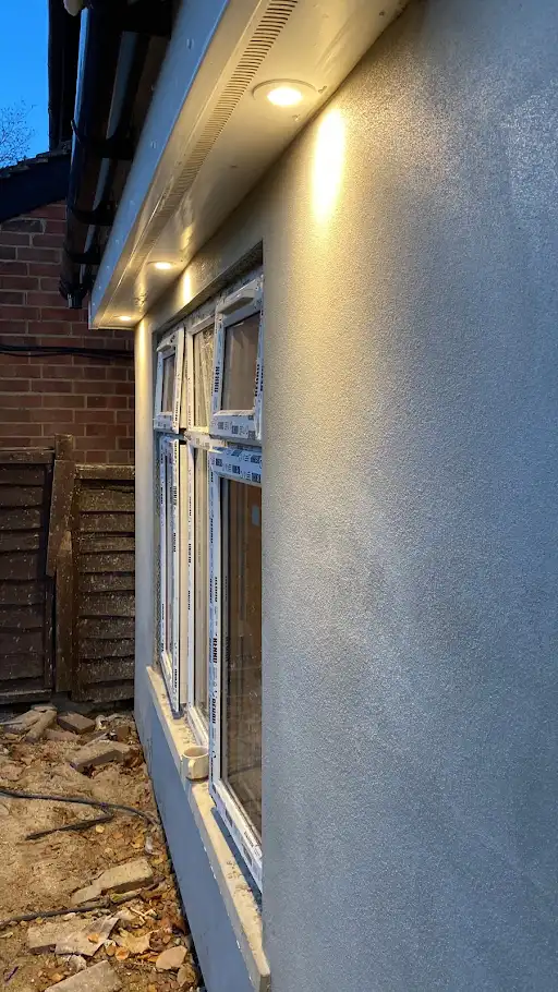 External render spray finish with downlights