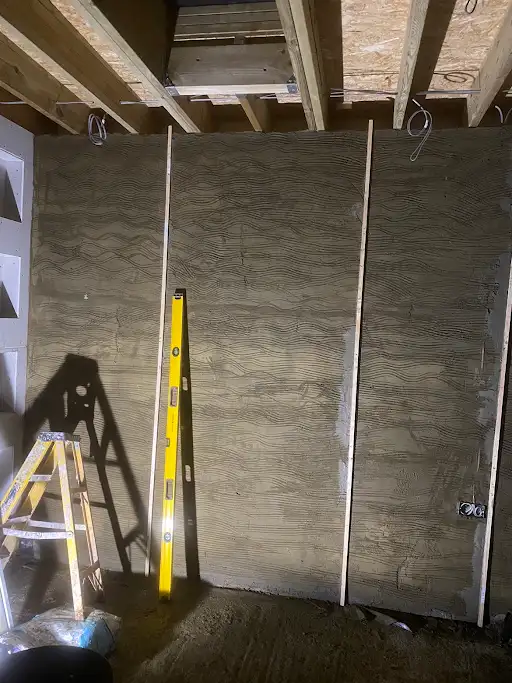 Blockwork wall scratch coat with screed rails