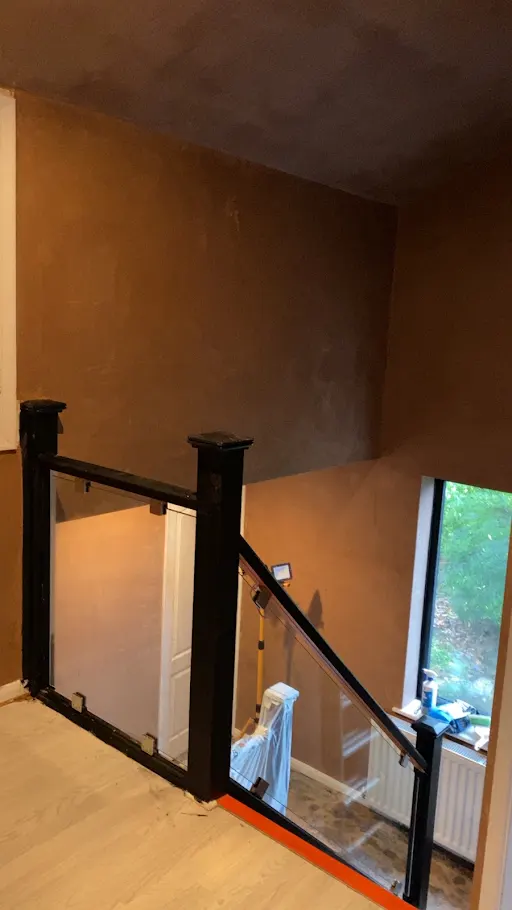 Stairwell landing skimmed glass balustrade
