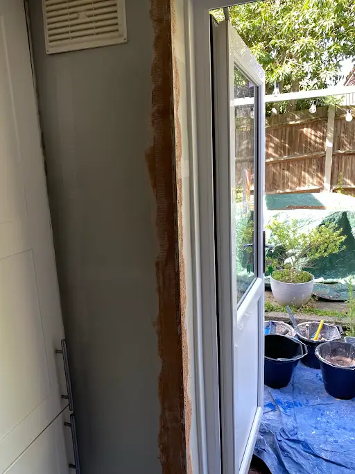Door reveal stripped, before