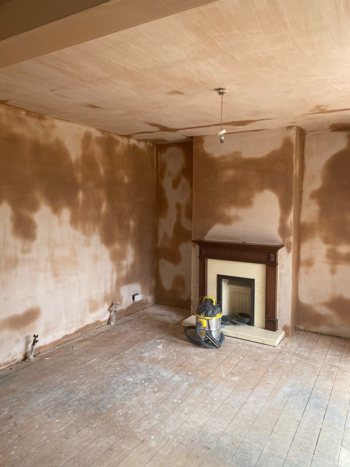 Living room walls and ceiling skimmed, after