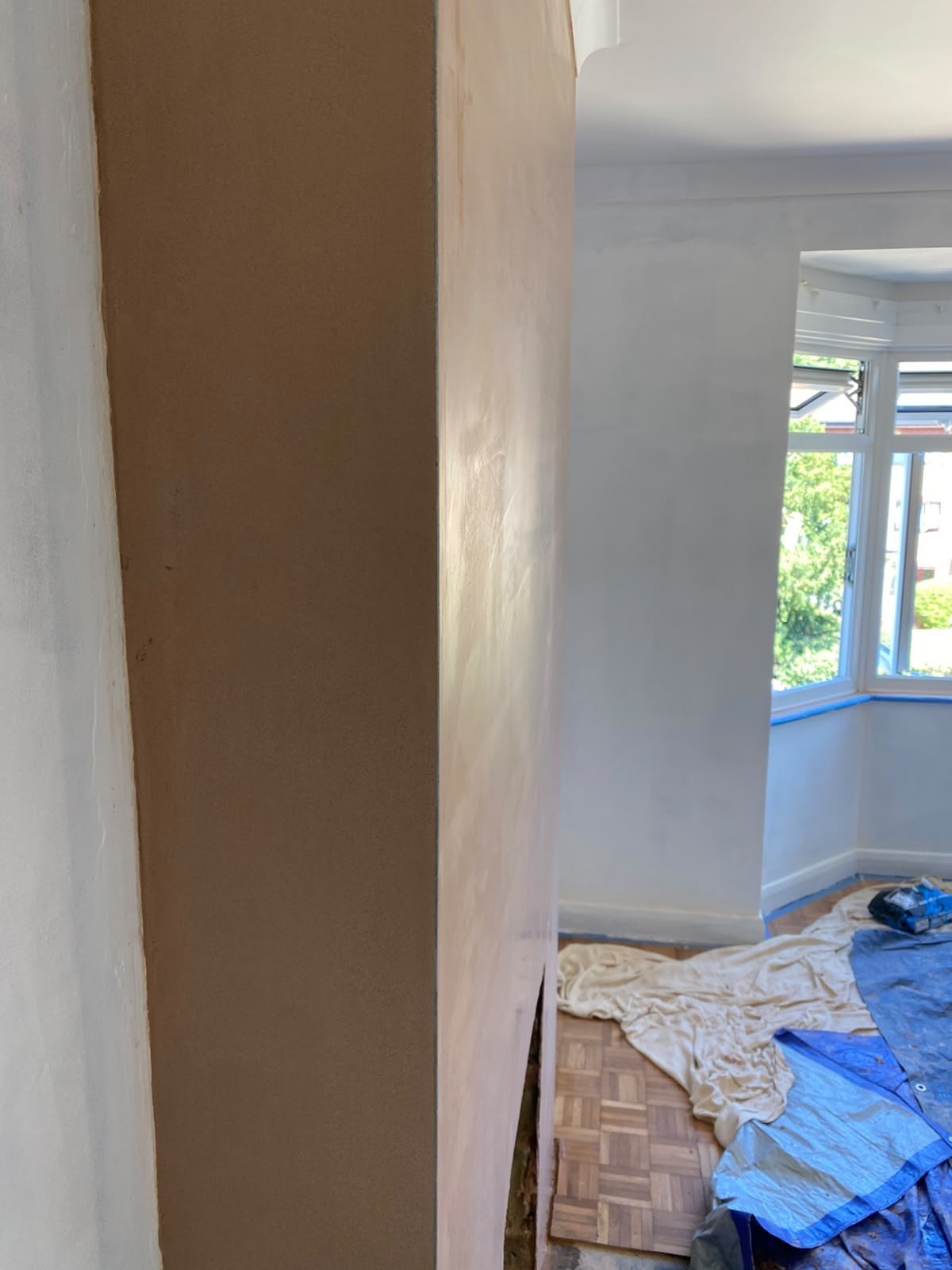 Bay reveal skimmed room sheeted, during