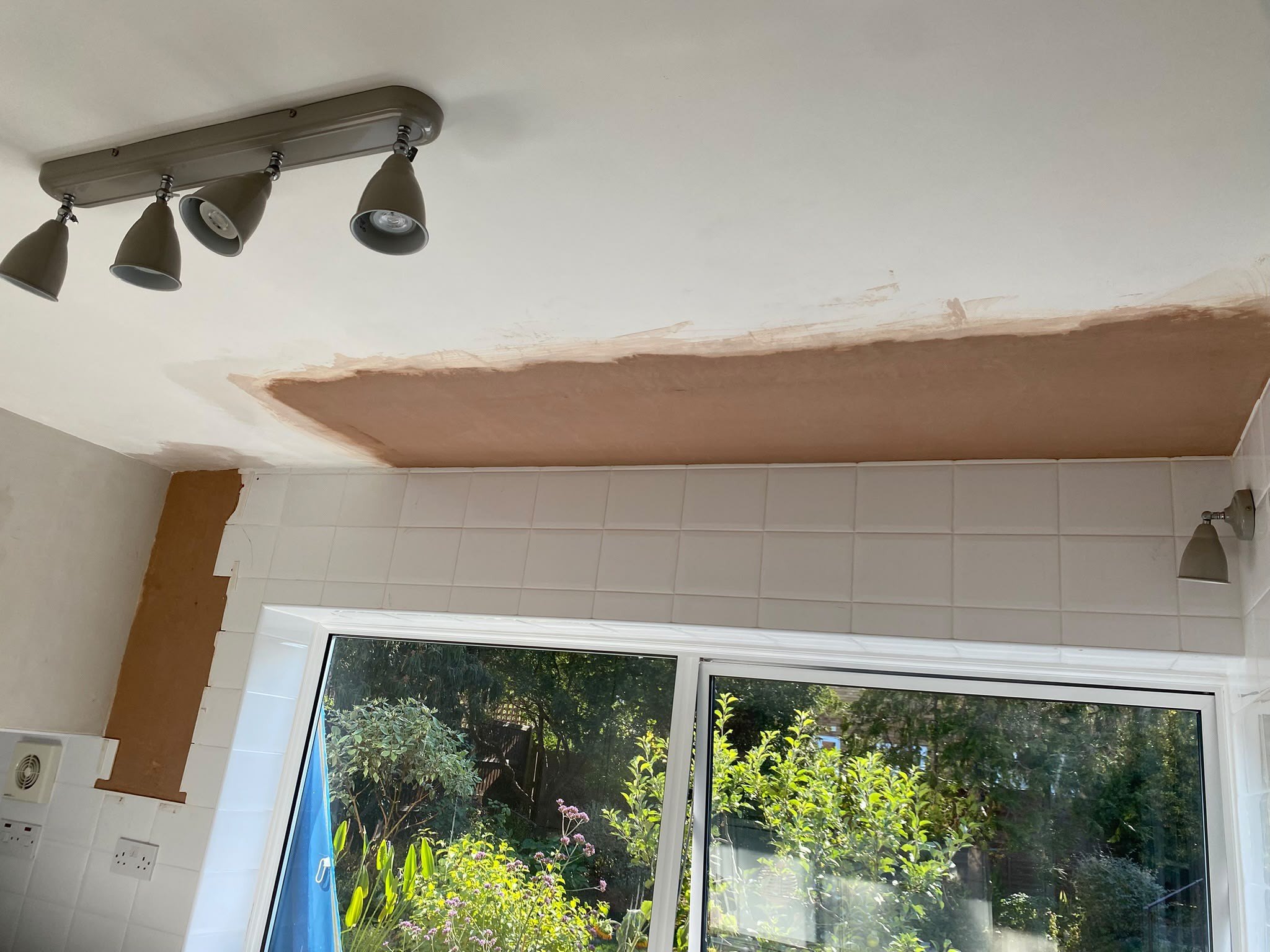 Kitchen ceiling patch skimmed over window, during