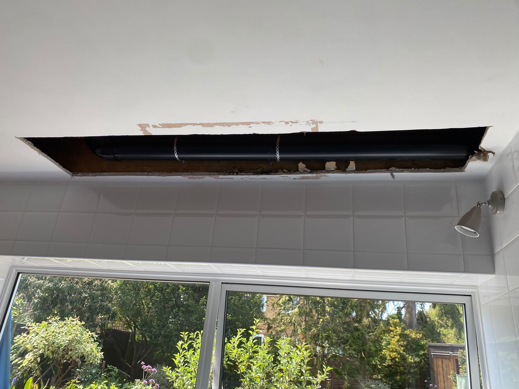 Kitchen ceiling opened over window, before