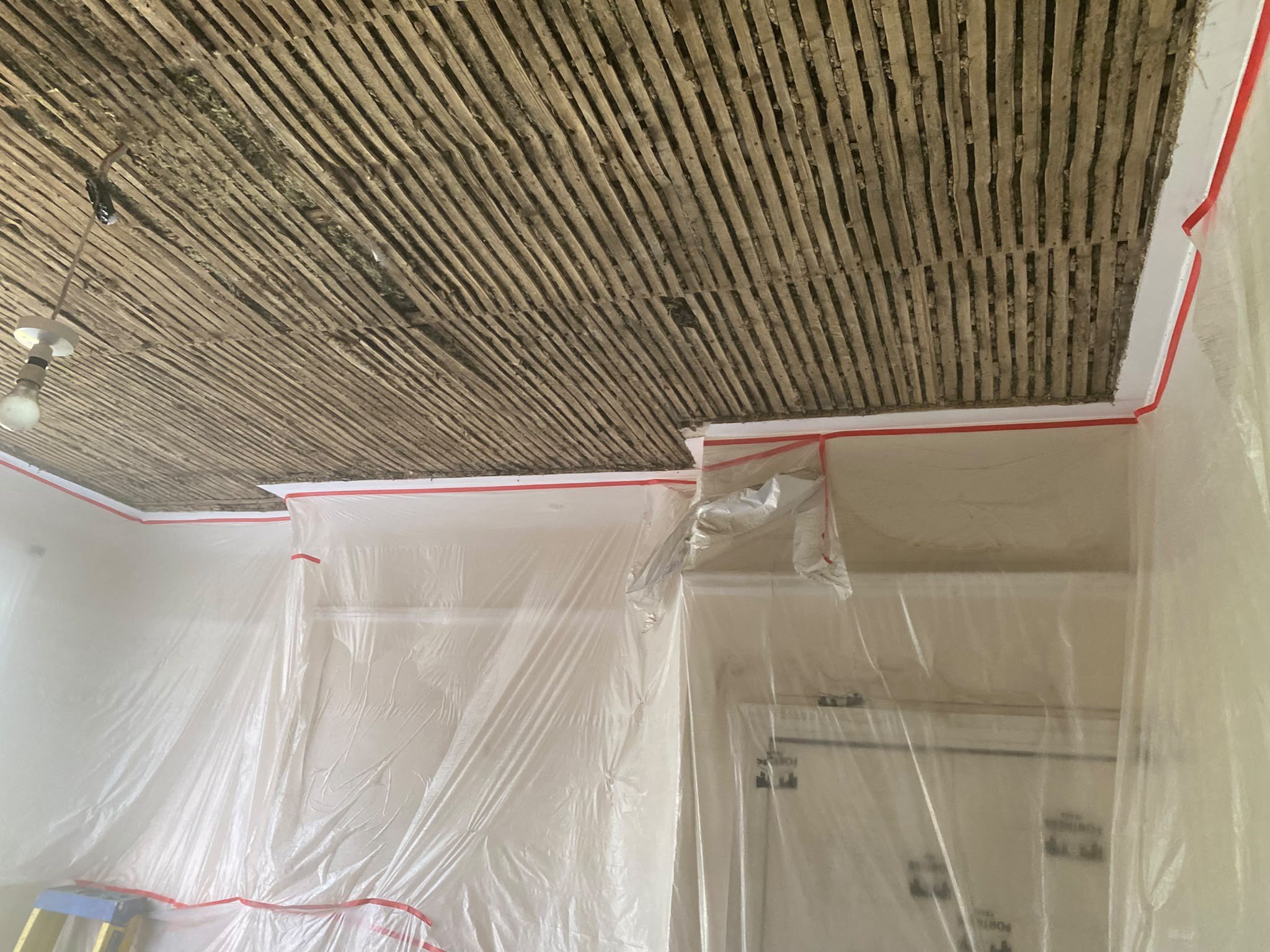 Lath and plaster ceiling exposed room sheeted, before